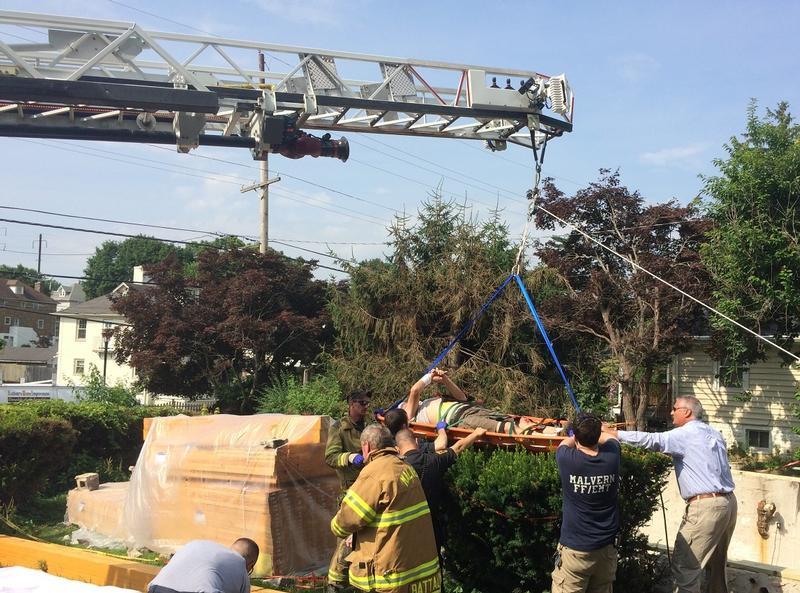 Ladder 4 assists EMS with the technical rescue of an injured person - July 2014